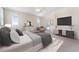 Spacious main bedroom with a ceiling fan and a door leading to the patio at 11720 Indian Hills Ln, Clermont, FL 34711