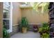 Charming outdoor patio space with lush greenery and stone accents at 11720 Indian Hills Ln, Clermont, FL 34711