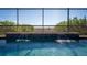 The beautiful pool has a calming waterfall and overlooks wonderful nature views at 11720 Indian Hills Ln, Clermont, FL 34711