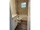 Bathroom features tile flooring, shower-tub combo, and granite vanity at 13075 Se 35Th Ct, Belleview, FL 34420