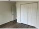 Bedroom features wood floors and closet at 13075 Se 35Th Ct, Belleview, FL 34420