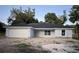 Charming one-story home with a two car garage, and light blue exterior paint at 13075 Se 35Th Ct, Belleview, FL 34420