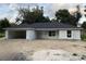 New construction home with an attached garage on a partially landscaped lot at 13075 Se 35Th Ct, Belleview, FL 34420