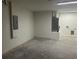 Spacious garage interior featuring concrete flooring and white concrete walls at 13075 Se 35Th Ct, Belleview, FL 34420