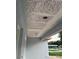 View of the covered porch with recessed lighting and textured ceiling at 13075 Se 35Th Ct, Belleview, FL 34420