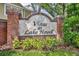 Landscaped brick sign welcomes you to Vistas at Lake Howell with vibrant greenery at 1541 Florentino Ln, Winter Park, FL 32792