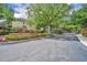 Community entrance showcasing well-maintained landscaping and gated access for added security at 1541 Florentino Ln, Winter Park, FL 32792