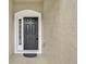 Inviting front door features sidelight window, modern door hardware, and a secure electronic keypad at 1541 Florentino Ln, Winter Park, FL 32792