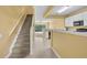 Hallway with view to stairs, kitchen, and living room at 1541 Florentino Ln, Winter Park, FL 32792