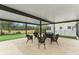 The outdoor patio area features comfortable seating and a putting green for recreation at 17726 Dangler Rd, Winter Garden, FL 34787
