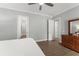 A neutral bedroom featuring wood floors, light gray walls, and simple white trim at 17726 Dangler Rd, Winter Garden, FL 34787
