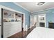 A blue bedroom with a full closet is connected to a bathroom at 17726 Dangler Rd, Winter Garden, FL 34787