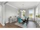 Bright dining room with table, chandelier, and large windows with natural light at 17726 Dangler Rd, Winter Garden, FL 34787
