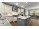 Bright kitchen with a large island, white cabinets, and stainless steel appliances at 17726 Dangler Rd, Winter Garden, FL 34787