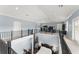 A spacious living room with a loft and plenty of natural light is perfect for entertaining guests at 17726 Dangler Rd, Winter Garden, FL 34787
