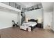 Spacious main bedroom features a spiral staircase leading to a loft and exercise bike at 17726 Dangler Rd, Winter Garden, FL 34787