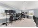 Office space featuring multiple monitors and a desk with views of the outdoors at 17726 Dangler Rd, Winter Garden, FL 34787