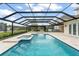 The pool with a spa and screened-in area offers an amazing outdoor relaxation and entertainment area at 17726 Dangler Rd, Winter Garden, FL 34787