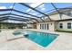 Backyard oasis with a pool, jacuzzi, screened in porch, and outdoor entertainment space at 17726 Dangler Rd, Winter Garden, FL 34787