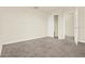Neutral bedroom featuring carpet flooring and a convenient closet for storage at 2200 Rapollo Dr, Kissimmee, FL 34741