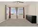 Bedroom with carpet, ceiling fan, and a large window with a great view at 2200 Rapollo Dr, Kissimmee, FL 34741