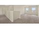 Spacious bonus room with plush carpeting and plenty of natural light at 2200 Rapollo Dr, Kissimmee, FL 34741
