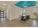 Spacious dining area featuring tile floors, ample natural light and a unique teal blue ceiling at 2200 Rapollo Dr, Kissimmee, FL 34741