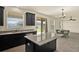 Modern kitchen featuring granite countertops, stainless steel appliances, and a central island at 2200 Rapollo Dr, Kissimmee, FL 34741