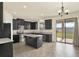 Well-equipped kitchen with an island, granite countertops, and stainless steel appliances at 2200 Rapollo Dr, Kissimmee, FL 34741