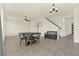 Bright and airy living space with tile flooring, a ceiling fan, and decorative wall art at 2200 Rapollo Dr, Kissimmee, FL 34741