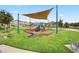 Community playground features modern equipment, a shaded canopy, and well-maintained green space for Gathering fun at 2200 Rapollo Dr, Kissimmee, FL 34741