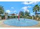Community splash pad with colorful water features and shade at 2200 Rapollo Dr, Kissimmee, FL 34741