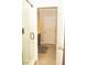 Bathroom showcasing a walk-in shower with glass doors, tile flooring, and a view into the vanity area at 2260 Rapollo Dr, Kissimmee, FL 34741