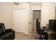 Bedroom with closet and chair near a computer desk at 2260 Rapollo Dr, Kissimmee, FL 34741