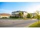 Beautiful two-story home boasts lush landscaping, privacy hedges, and inviting curb appeal at 2260 Rapollo Dr, Kissimmee, FL 34741
