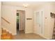 Welcoming foyer features tile flooring, coat hooks, and access to the staircase and other rooms at 2260 Rapollo Dr, Kissimmee, FL 34741