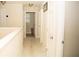 Hallway leading to bedrooms has neutral paint, trim, doors and flooring at 2260 Rapollo Dr, Kissimmee, FL 34741