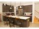 Kitchen featuring a center island with barstool seating, modern appliances, and granite counters at 2260 Rapollo Dr, Kissimmee, FL 34741