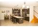 Spacious kitchen features a large island with seating, ample cabinetry, and modern lighting at 2260 Rapollo Dr, Kissimmee, FL 34741