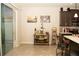 Bright kitchen featuring tile flooring and a wine rack at 2260 Rapollo Dr, Kissimmee, FL 34741