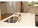 A view of the kitchen island featuring a marble countertop and sink at 2260 Rapollo Dr, Kissimmee, FL 34741