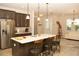 Kitchen featuring a center island with barstool seating and modern appliances at 2260 Rapollo Dr, Kissimmee, FL 34741