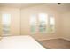 Bright main bedroom with large windows and neutral carpet creating a welcoming and airy space at 2260 Rapollo Dr, Kissimmee, FL 34741