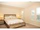 Spacious main bedroom with vaulted ceilings, plush carpet, and a stylish bed frame at 2260 Rapollo Dr, Kissimmee, FL 34741