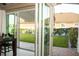 The covered patio with sliding glass doors offers seamless indoor-outdoor living with a view of the backyard at 2260 Rapollo Dr, Kissimmee, FL 34741