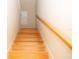 Bright staircase features wood stairs and banister at 2260 Rapollo Dr, Kissimmee, FL 34741