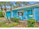 Inviting front entrance with brick walkway, chairs, and lush landscaping adding to its curb appeal at 2565 Brookshire Ave, Winter Park, FL 32792