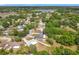 Aerial view of a home surrounded by mature trees in a well-established neighborhood at 2617 Greywall Ave, Ocoee, FL 34761
