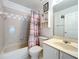 Bathroom showcasing a tub-shower, single vanity, toilet, and neutral wall color at 2617 Greywall Ave, Ocoee, FL 34761
