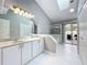 Bright bathroom featuring a double vanity, shower, and natural light at 2617 Greywall Ave, Ocoee, FL 34761